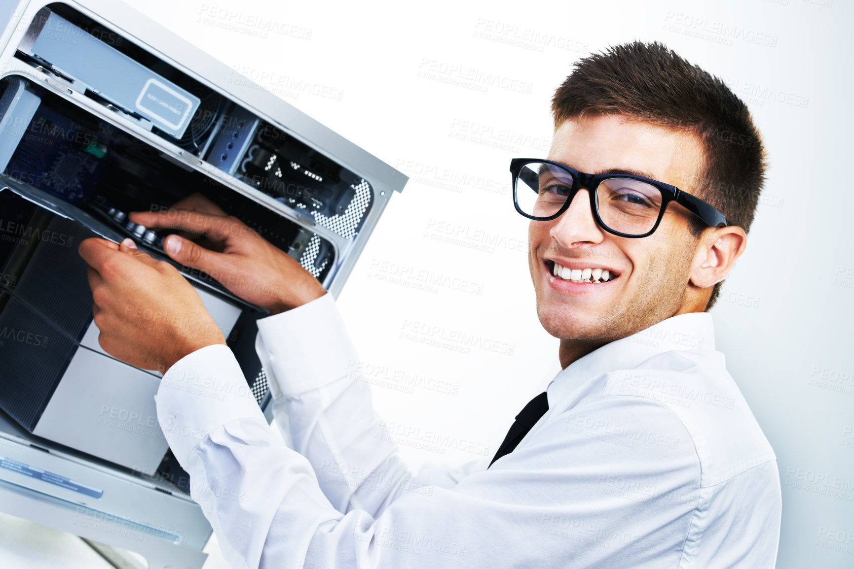 Buy stock photo Computer tower, portrait and happy man repair studio hardware, electronics or check electrical machine. System maintenance expert, happiness and IT support fixing tech equipment on white background