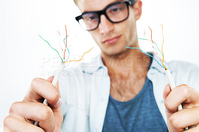 Buy stock photo Working, electrician and man with cables, test and and check for power in white background. Studio, technician or electricity, wires and maintenance of connection, technology or hardware closeup