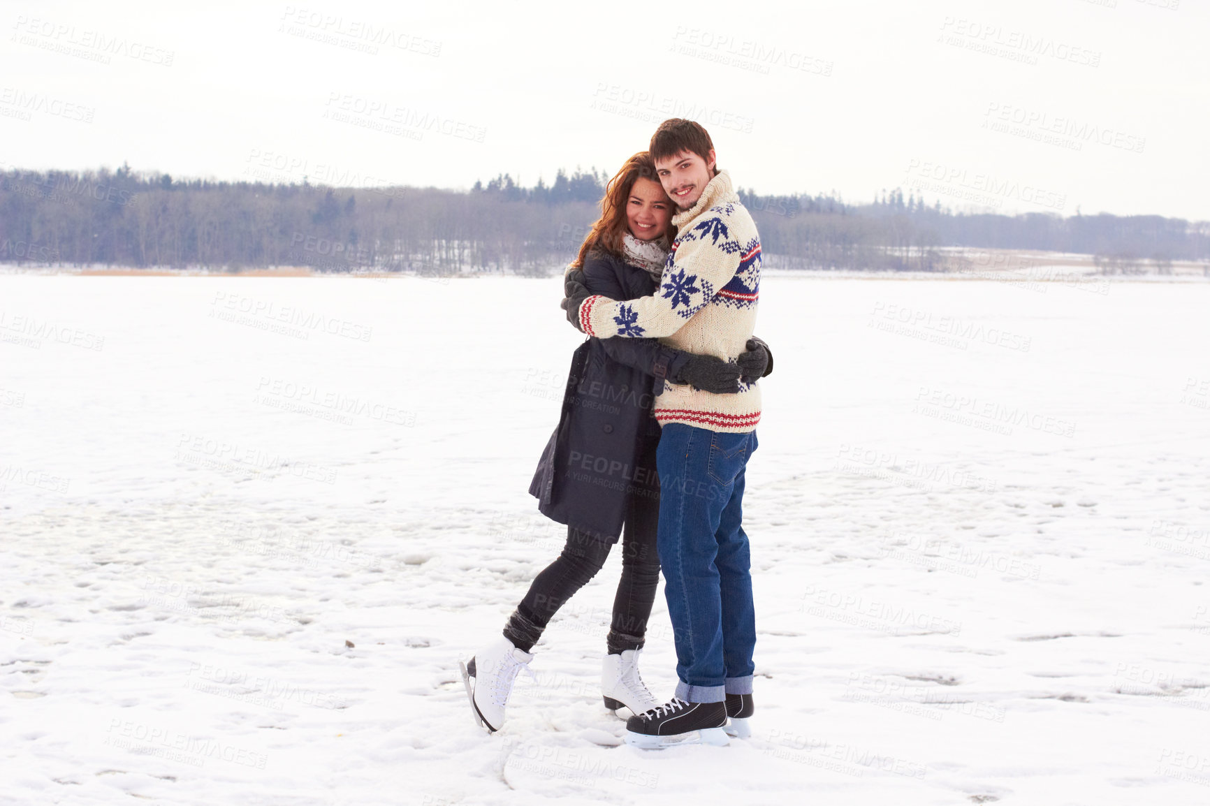 Buy stock photo A young couple on an ice skating date at a frozen natural lake