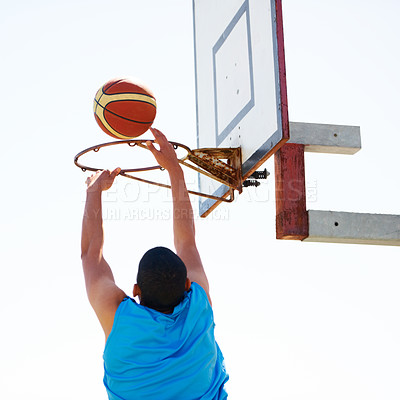 Buy stock photo Man, basketball and dunk jump outdoor for shooting point as athlete, game challenge or fun. Male person, hand and score at hoop for summer exercise match or fitness training sport, player on court