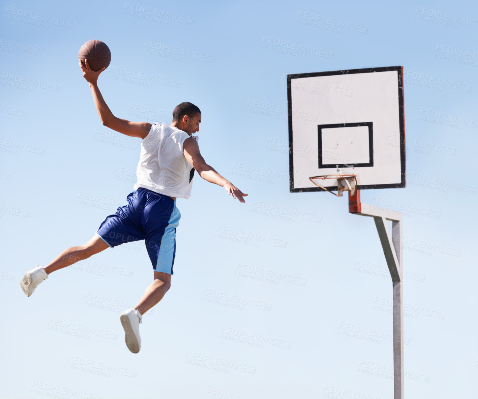Buy stock photo Man, basketball and dunk jump on outdoor court for scoring point, game challenge or athlete. Male person, hand and hoop strong for exercise fun or fitness training in summer, player for winner match