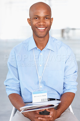Buy stock photo Business, portrait and young black businessman sitting in workshop and conference room at work. Convention, tradeshow and happy African male corporate worker with documents on lap in presentation