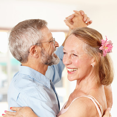 Buy stock photo Senior couple, dancing and happy in home, romantic and ballroom for fun, touch and love. Retirement, bonding together and smile for husband, wife and quality time with tango, retired and elderly
