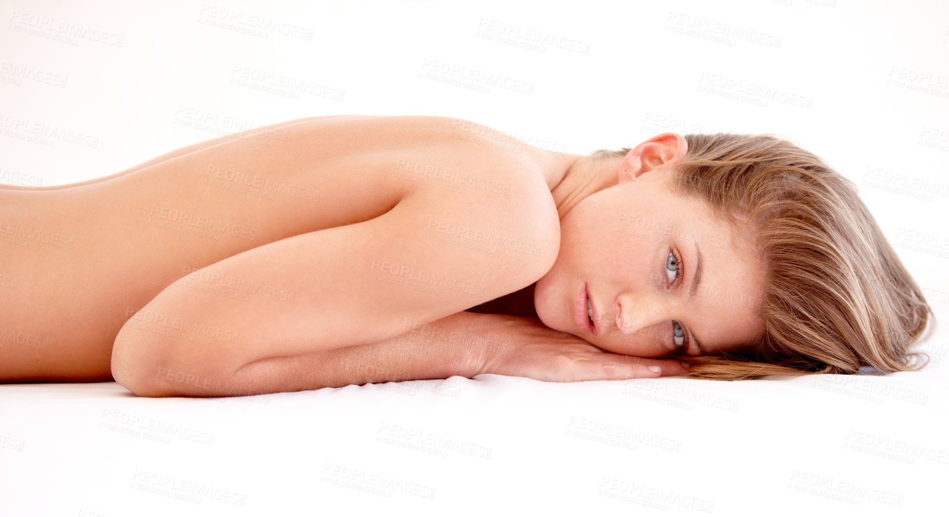 Buy stock photo Sexy, beauty and portrait of woman in bed with confidence, seductive and sensual pose in studio. Natural makeup, naked and beautiful, gorgeous and attractive female person laying on white background