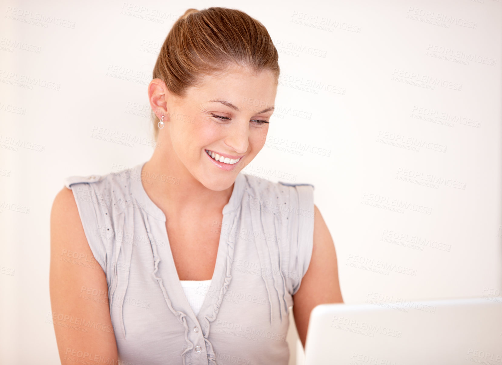 Buy stock photo Laptop, happy and woman online in studio for research, internet and reading news on website. Smile, technology and person on computer for connection, networking and streaming on white background