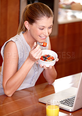 Buy stock photo Laptop, happy and woman with fruit breakfast in home for website, internet and reading news blog. Smile, morning and person on computer for connection, networking and streaming service in kitchen