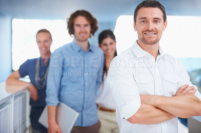Buy stock photo Cropped shot of four coworkers standing in the office