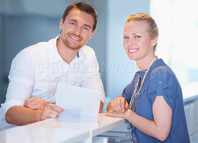 Buy stock photo Business people, teamwork portrait and documents for advice, financial report and taxes or revenue in office. Professional woman and manager smile with paperwork for accounting, audit or sales review