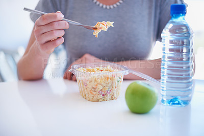 Buy stock photo Hand, fork and employee eating food in the cafeteria on a lunch break for health, diet or nutrition closeup. Water, apple and noodle salad with a business person in the office for a meal or snack