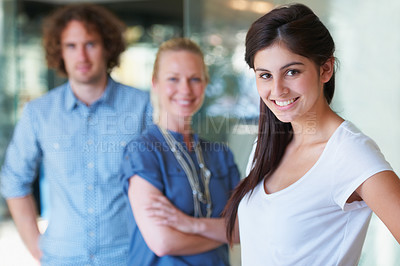 Buy stock photo Smile, confident and portrait of business woman in the office with team for management and creative internship. Happy, career and professional female designer from Canada with employees in workplace.