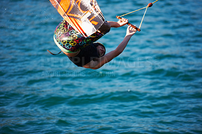 Buy stock photo Man, wakeboarding and ocean with jump, sport and fitness with speed on vacation in summer sunshine. Person, athlete and ski with rope for safety on lake, sea or river with training, exercise or waves