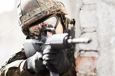 Buy stock photo Closeup of a soldier pointing his gun at the camera