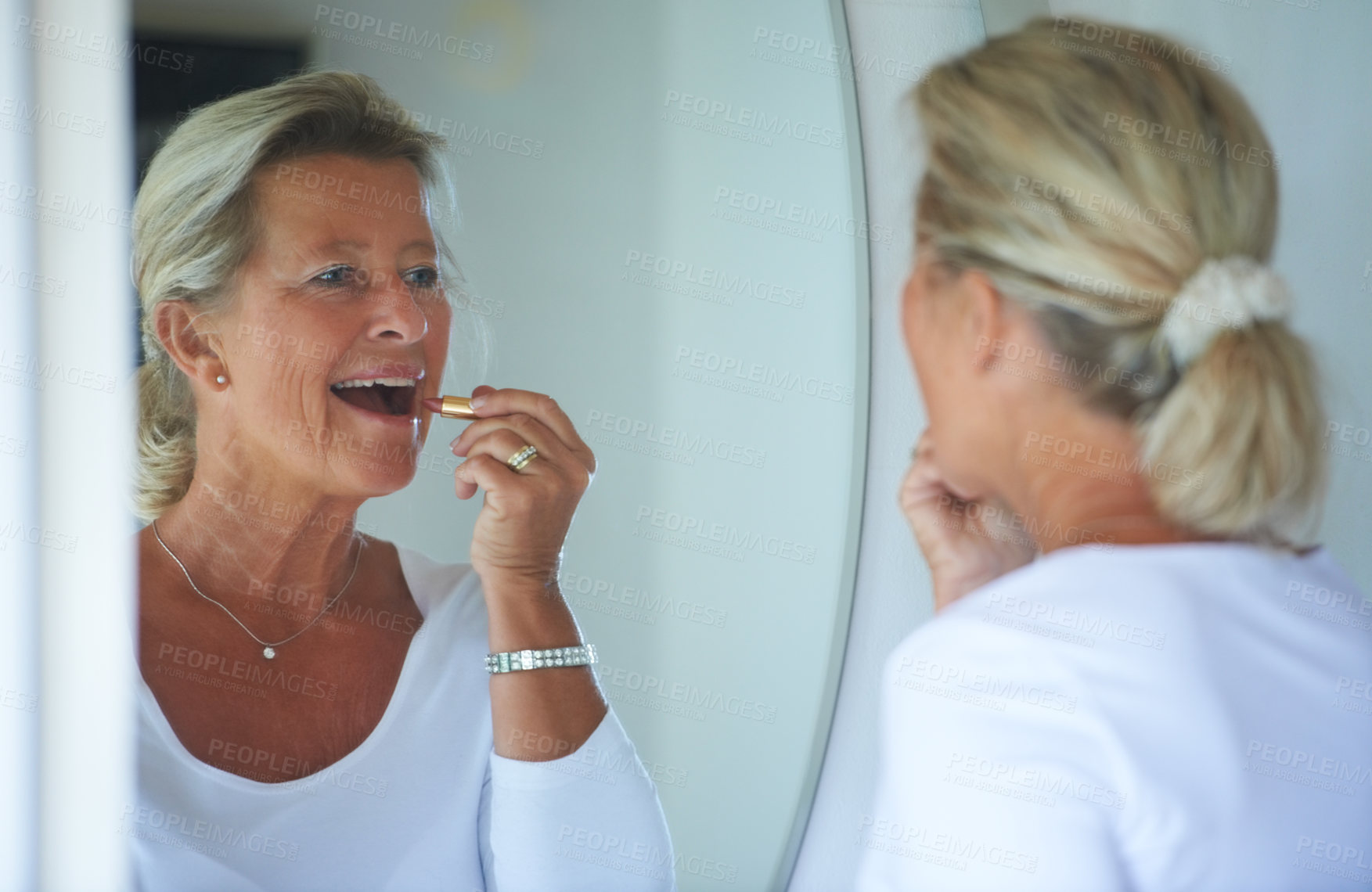 Buy stock photo Senior woman, lipstick and mirror in home with smile, thinking and beauty to start morning in retirement. Elderly person, makeup and product for lips, reflection and happy in bathroom for cosmetics