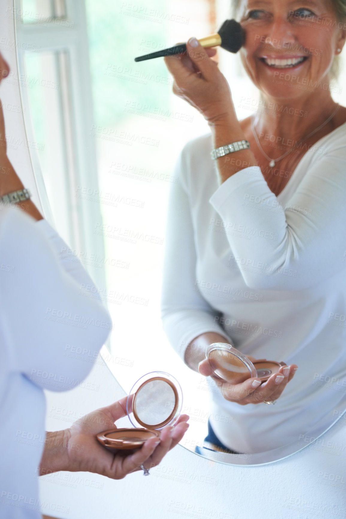 Buy stock photo Senior woman, brush and makeup in mirror with smile, thinking and beauty to start morning in retirement. Elderly person, foundation and check reflection in home bathroom, happy and facial cosmetics