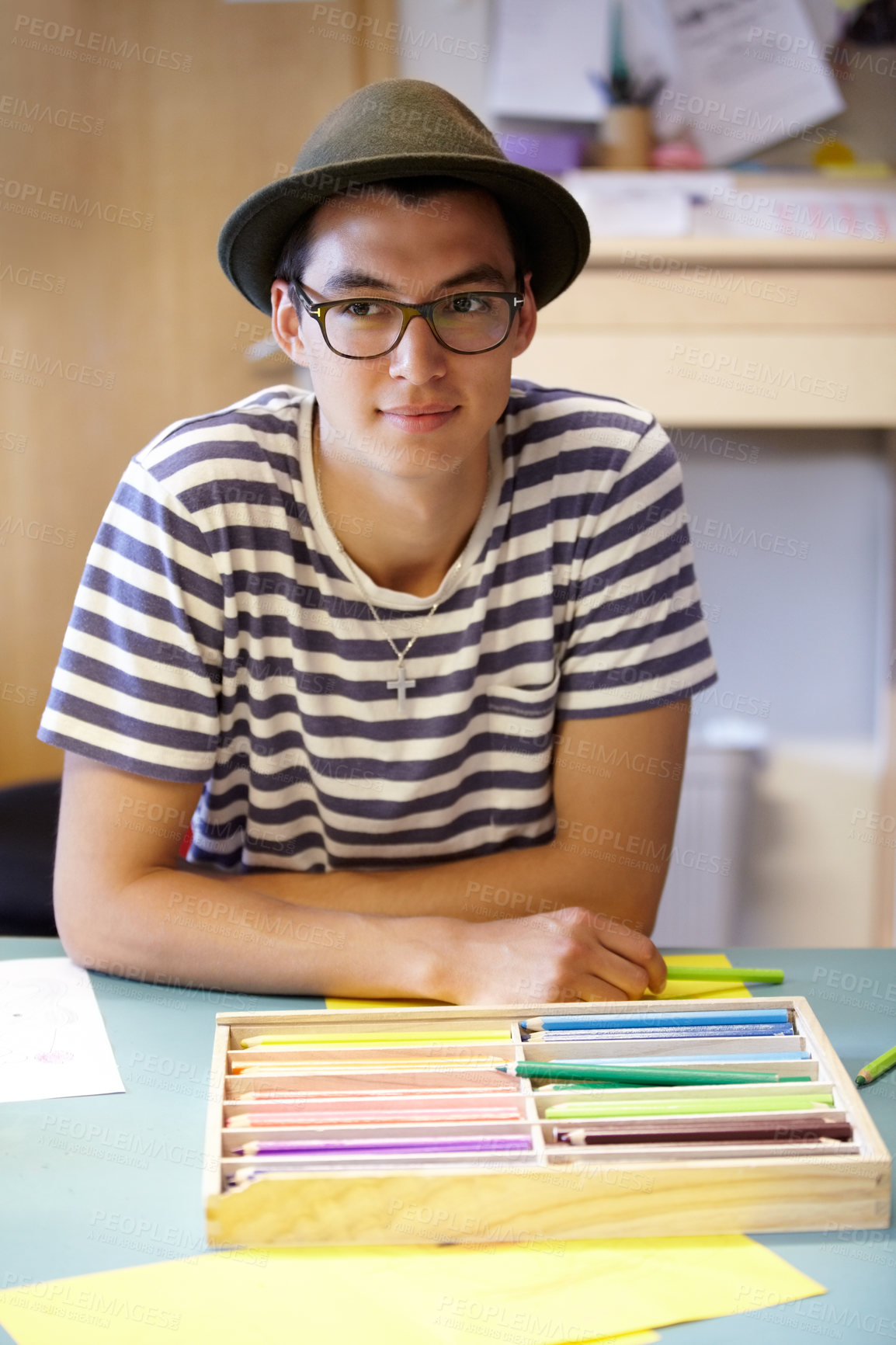 Buy stock photo Drawing, teacher and man at table in kindergarten with stationery, creativity and thinking about school. Teaching assistant and person with ideas for montessori, learning and inspiration in classroom