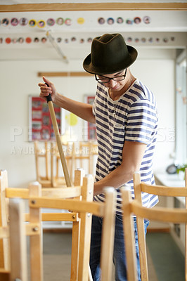 Buy stock photo Man, cleaning and teacher in class at school sweeping floor with dirt, mess or furniture in afternoon or morning. Classroom, broom or janitor clean mud from space for sanitary, maintenance or hygiene