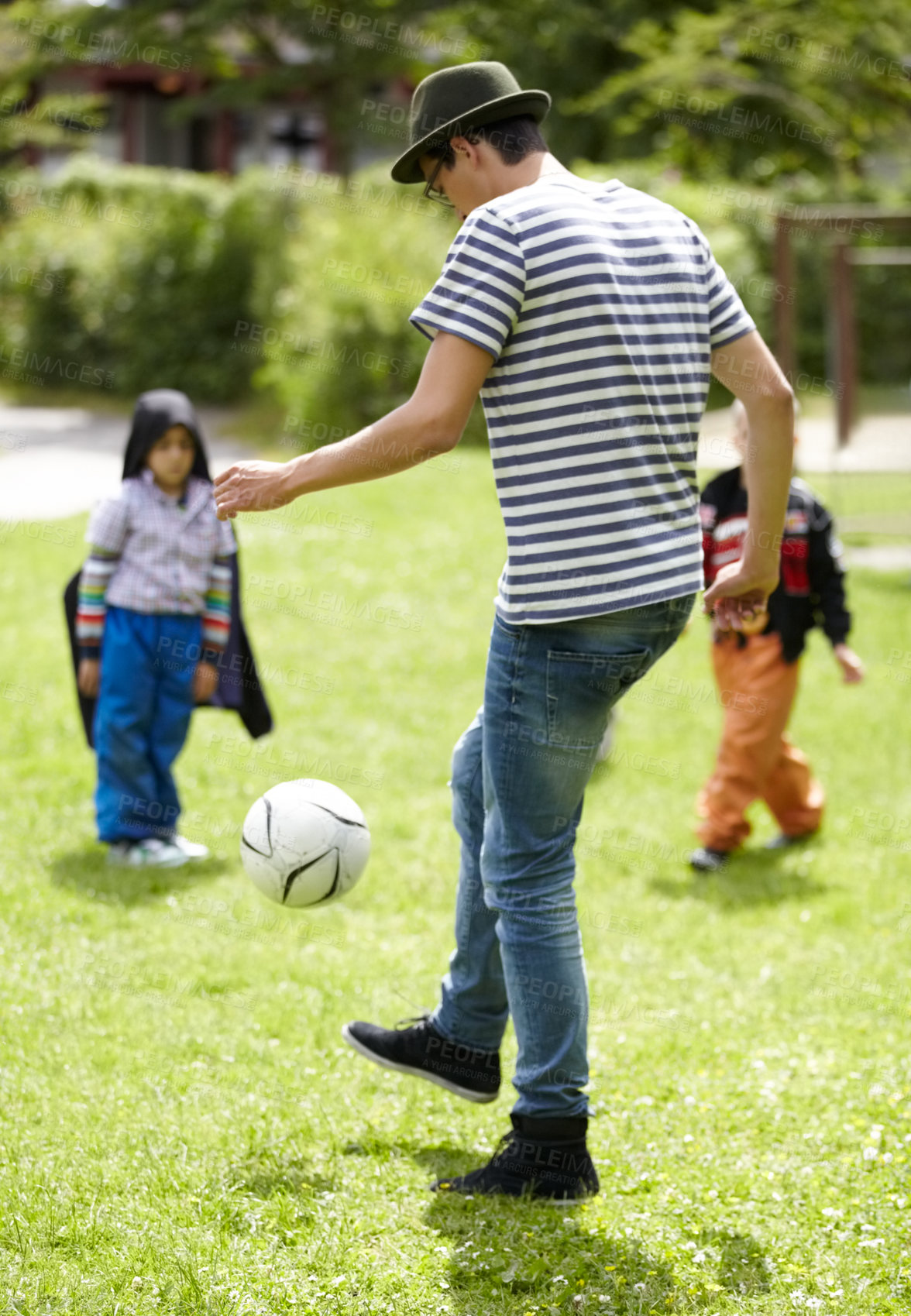 Buy stock photo Kindergarten, teacher and playing football with children on grass, lawn or field with game or sport. Soccer, ball or kids with man training to kick or play on playground with fun exercise or activity