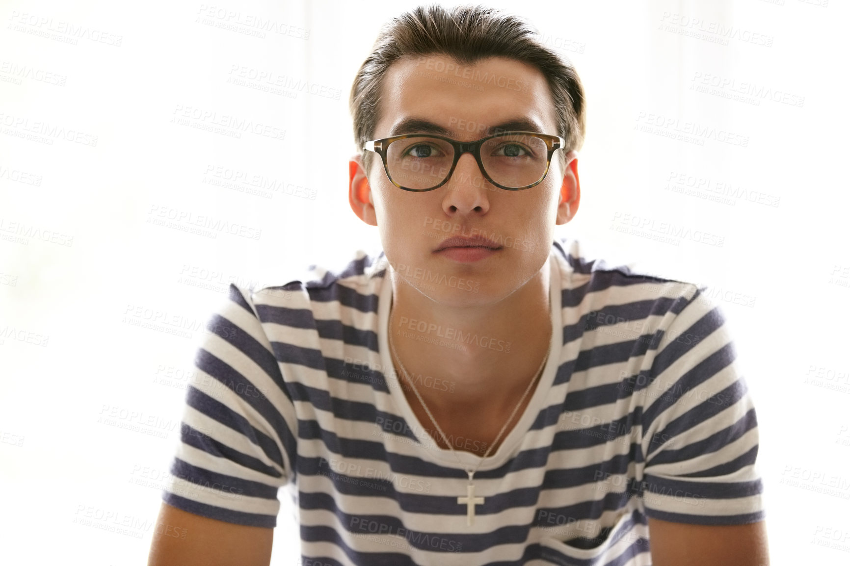 Buy stock photo Serious, man and portrait with glasses in studio, white background and eyewear spectacles mockup. Person, face and Christian male with necklace and frames with lenses for vision, sight and fashion