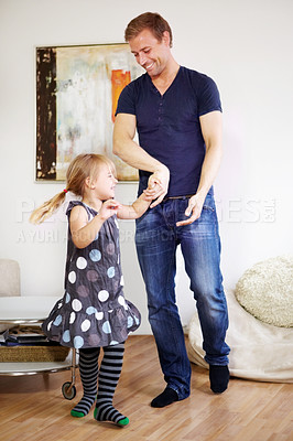 Buy stock photo Shot of a young father bonding with his little daughter