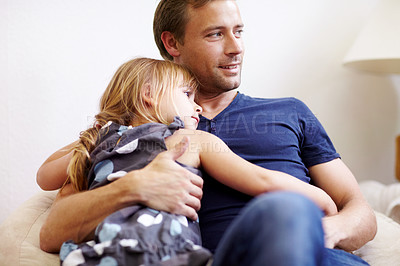Buy stock photo Father, girl and hug with smile, couch and embrace with love, daughter and house. Man, happy and lounge or bonding together for affection, family and parent with child, caring and family home