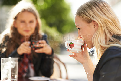 Buy stock photo Women, friends and drinking coffee at shop, meeting and reunion together. Girls, people and tea cup at cafe, restaurant table and customer enjoying latte at cafeteria store to relax outdoor in city