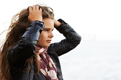 Buy stock photo Face, thinking and regret with a woman outdoor in the fresh air for fashion on a mockup sky background. Travel, idea and daydreaming with a young person outside for trip, adventure or tourism