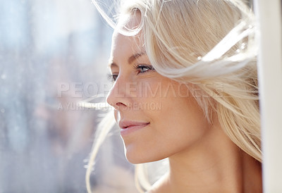 Buy stock photo A gorgeous blond woman looking away thoughtfully
