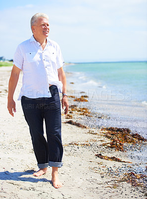 Buy stock photo Beach, walking and elderly man on a travel tropical vacation, holiday or weekend trip in summer. Adventure, outdoor and senior male person in retirement on the sand by the ocean or sea on getaway.