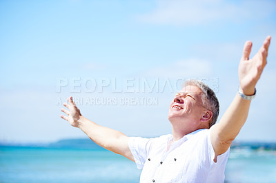 Buy stock photo Beach, freedom and happy senior man with open arms in nature for travel, adventure or celebration. Ocean, smile and elderly male person with retirement vacation at the sea with gratitude in Bali