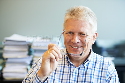 Buy stock photo Portrait of a senior businessman sitting in his office