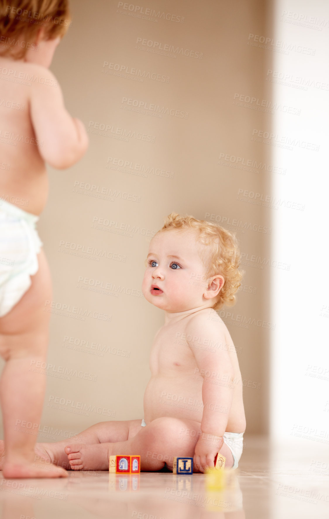 Buy stock photo Baby, siblings and building blocks on a a floor for learning, playing or bonding in a nursery room together. Family, fun and curious children with toys for child development, coordination or color 