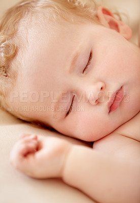 Buy stock photo Tiny baby boy lying fast asleep