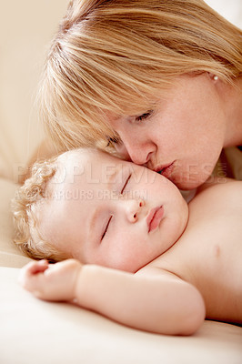 Buy stock photo Family, love and a mother kissing her baby closeup on a bed in their home for bonding together. Face, sleeping and an infant child in the bedroom of an apartment with his woman parent for affection