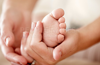 Buy stock photo Baby, feet and closeup of hands of mother in a house with love, care and support, nurture and protection. Family, zoom and toes of kid with parent at home for child development, bonding and comfort