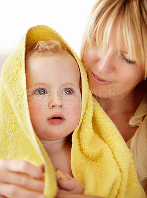 Buy stock photo Bath, towel and baby with mother in a house for love, care and comfort, bond or routine. Family, face and mom with boy child in a bathroom with care, security or hug after cleaning, washing or shower