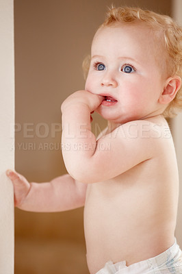 Buy stock photo Face, hands and baby in a room for playing, watching or fun, learning, walk or balance. Little, child development and curious boy kid in a nursery playful, standing and enjoy youth, freedom or games