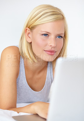 Buy stock photo Thinking, home and woman with a laptop, typing and planning with happiness, solution and internet. Person, apartment and girl with a pc, decision or online with choice, problem solving and connection