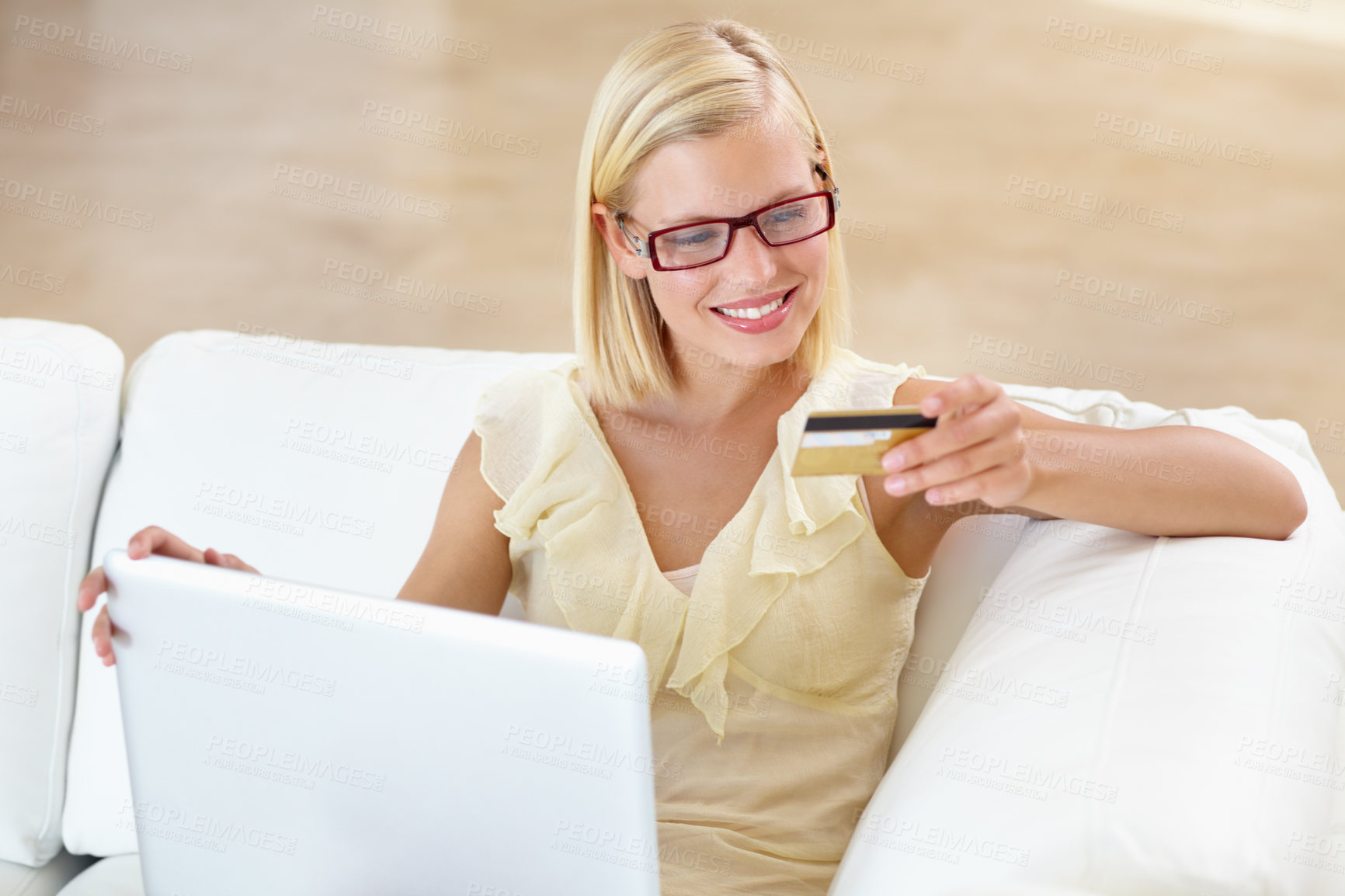 Buy stock photo A gorgeous young woman buying something online with her credit card