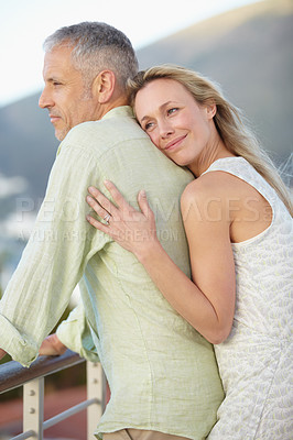 Buy stock photo Happy couple, hug and love on balcony in marriage, embrace or care on honeymoon together. Married female person hugging fiance with smile in relax for support, trust or commitment on romantic getaway