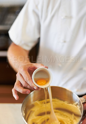 Buy stock photo Baker, baking process and egg in batter for cake, confectionery culinary skills and person in bakery kitchen. Closeup, food and chef cooking dessert, catering industry and mixing ingredients