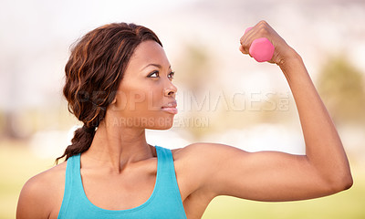 Buy stock photo African woman, dumbbell training and outdoor for focus, strong arm muscle or goal for wellness, Girl, workout and fitness in park, garden or backyard with pride, concentration and health in lifestyle