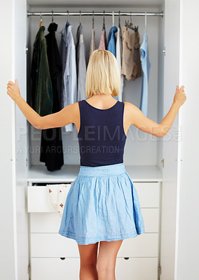 Buy stock photo Back, woman and closet for clothes choice, fashion option and decision in home or house. Rear view, girl and wardrobe for clothing selection, person thinking of outfit to wear and style in bedroom