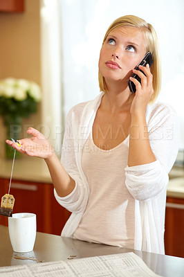 Buy stock photo Woman, phone call and conversation in kitchen, news and communication on technology at home. Female person, smartphone and discussion or tea, connection and newspaper or newsletter, chat and talk