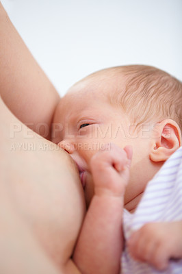 Buy stock photo Closeup, woman and baby for breastfeeding in home for hunger, food and wellness in health. Love, bonding and relationship in motherhood with nutrition in childcare for growth, development and future