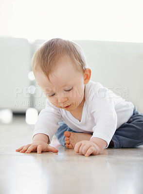 Buy stock photo shot of a cute baby playing while sitting on the floor