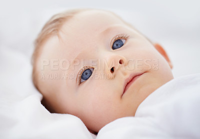 Buy stock photo Closeup shot of an adorable baby lying in his crib