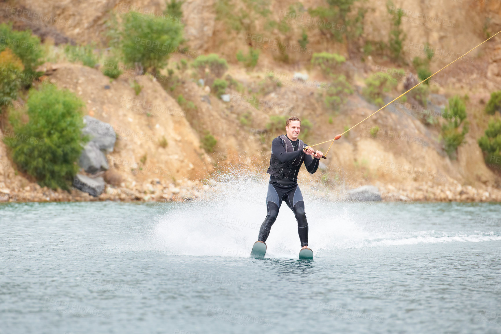 Buy stock photo Nature, water ski and adventure, man on lake with outdoor fun, fitness and wave splash. Balance, extreme sports and person on river with freedom, speed and energy in surfing challenge, rope and spray