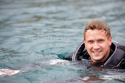 Buy stock photo Man, waterski and portrait in lake, happy and outdoor waiting for tow with fitness, extreme sports or exercise. Person, smile and river in nature, float and swimming for health with summer training