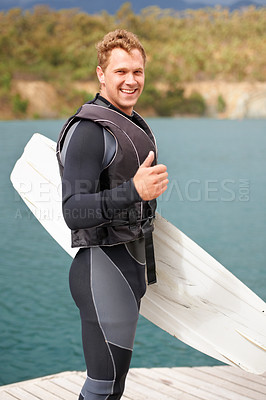 Buy stock photo Lake, thumbs up and portrait of man with wakeboard for surfing, exercise and hobby outdoors. Fitness, extreme sports and person with emoji and board for water skiing for freedom, adventure and fun
