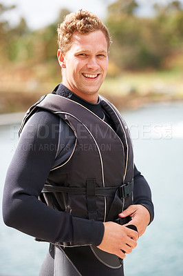 Buy stock photo Man, ready and life jacket at lake, summer or portrait for extreme sports for fitness, exercise or workout. Person, happy and safety vest by river, nature or smile for pride, health or start training